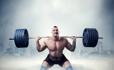 Muscular male weightlifter exercise with barbell - obrazy, fototapety, plakaty