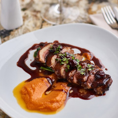 Duck breast Magret with mashed nutmeg pumpkin dressed with porto sauce