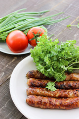 Grilled sausages on the coals