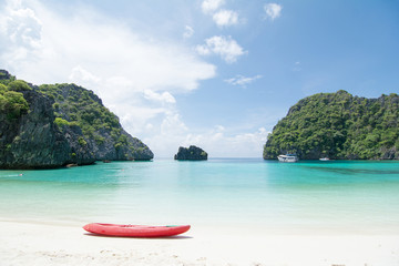 Looking  to red Kayaking with beautiful ocean view, white beach and crystal clear water at...