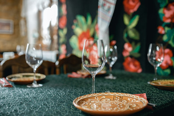 Wine glasses and table serving in rustic style restaurant