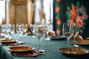 Wine glasses and table serving in rustic style restaurant