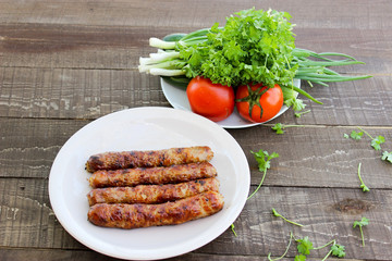 Grilled sausages on the coals