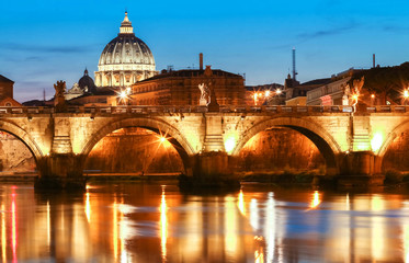 Obraz premium The SaintAngel bridge and St. Peter's Basilica , Rome, Italy .