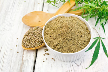 Flour hemp in bowl with spoons on board