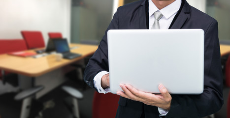 Businessman hold laptop computer