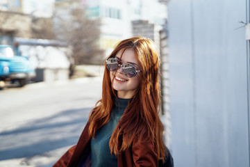 happy woman is walking around the city, street