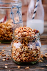 Healthy breakfast homemade granola in glass jar