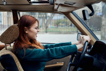 Plakat energetic woman driving a car