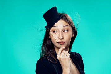 paper hat, beautiful woman in a dark jacket