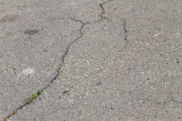 Texture with cracks on asphalt background