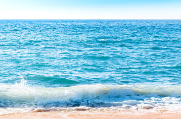 Naklejka na ściany i meble Ocean surface with waves near the beach