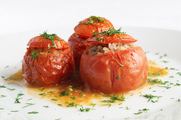  tomatoes with meat and rice filling braised in white wine and tomato juice 