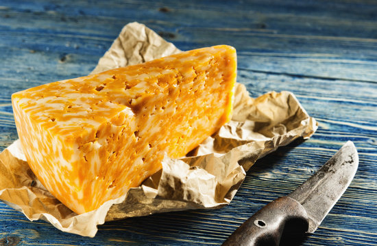 Cheese lying on a wooden table