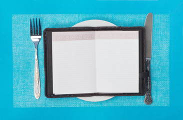 A notebook on a plate