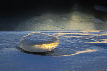 Ice figure in the rays of the setting sun. VI