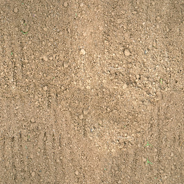 seamless texture of brown fluffy fresh plowed land.