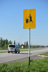 The sign by the road, throw garbage in the trash