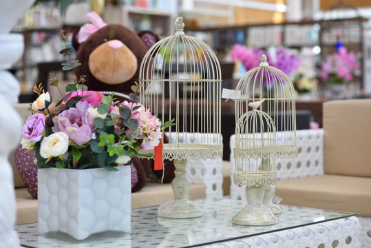 Beautiful decorative birdcages on the table