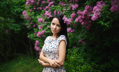 Fototapeta premium Beautiful girl portrait in a pink flowers