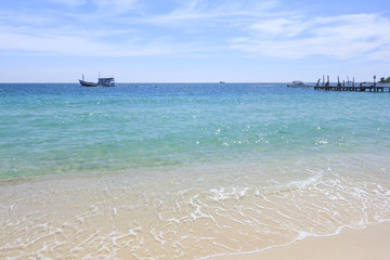 Summer tropical sea and beach in blue sky.