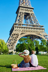 Romantic couple having picnic together in Paris