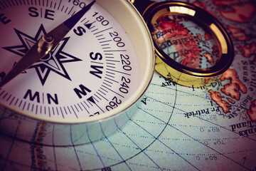 compass and magnifying glass