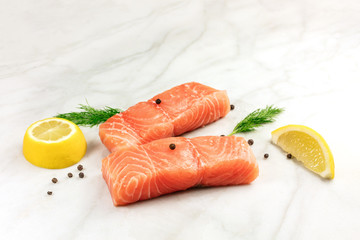 Photo of slices of salmon on white with copyspace
