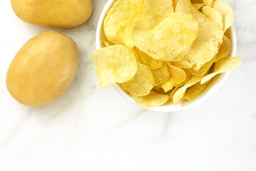 Chips with potatoes, shot from above with copyspace