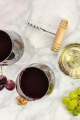 Glasses of red and white wine at tasting © laplateresca