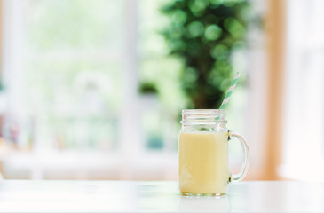 Mango smoothie in a bright room