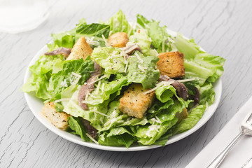 Caesar Salad with Anchovies and Croutons - obrazy, fototapety, plakaty