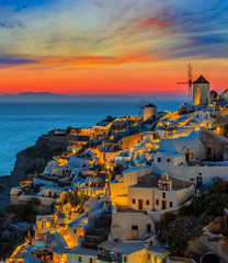 Amazing view with white houses in Oia village. - obrazy, fototapety, plakaty