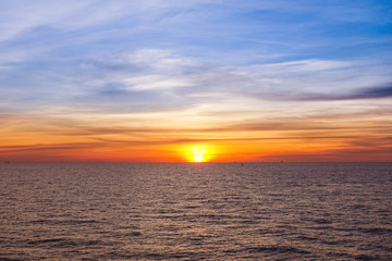 Sunset at sea with beautiful clouds in the evening and twilight.