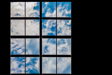 Lattice window overlooking the sky and clouds