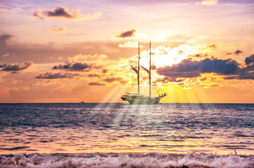 Beach sand with boat in twilight and sea sunset and sunbeam
