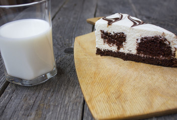 cake and milk on a wooden table