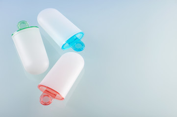 Ice cream molds lying on light grey surface, right space for text