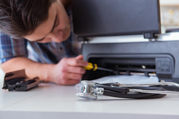 Repairman repairing broken color printer