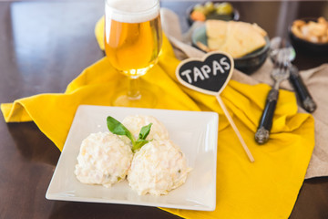  Spanish Tapas. Russian salad in a white plate. Ensaladilla rusa.