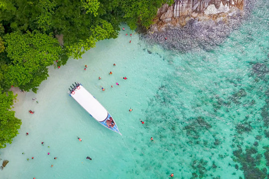 Aerial view over speed boat with beautiful sea and beach,Top view from drone, Koh Lipe island, Satun,Thailand