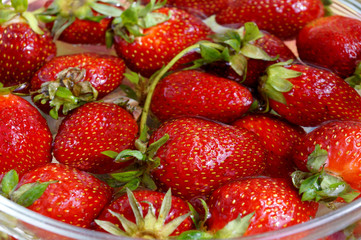 Fresh strawberry in capacity with water