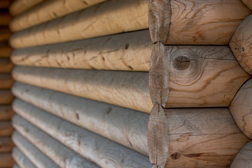 The wall of a wooden house from calibrated logs