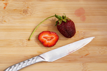 Fresh strawberry cut on a chopping board