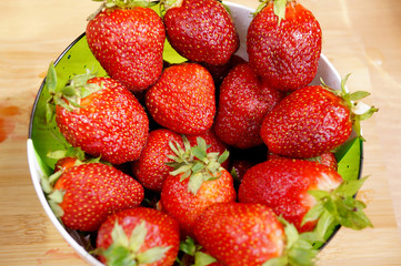 Bright fresh strawberry in a round container
