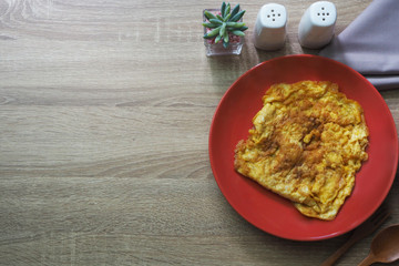 Texture brown wooden for background consist of omelet and other side dishes. Copy space