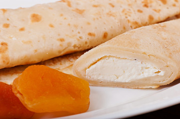 Pancakes stuffed with cheese, delicious food.