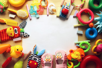 Fototapeta na wymiar Children's toys and accessorieson a wooden background