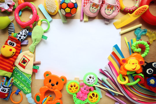 Children's toys and accessorieson a wooden background
