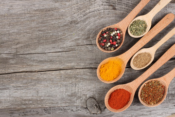 Herbs and spices on wooden background. Top view with copy space